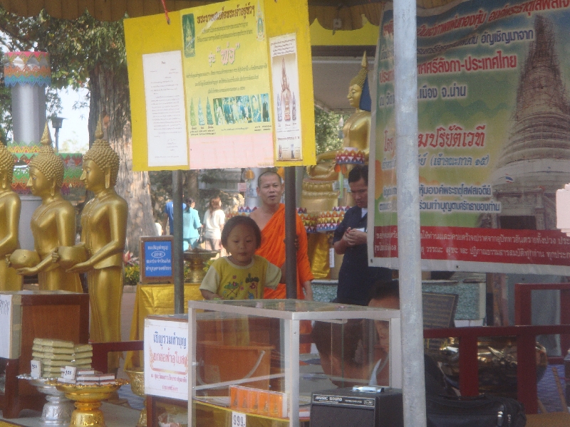 Chedi stand selling flowers and incense, Nakhon Pathom Thailand