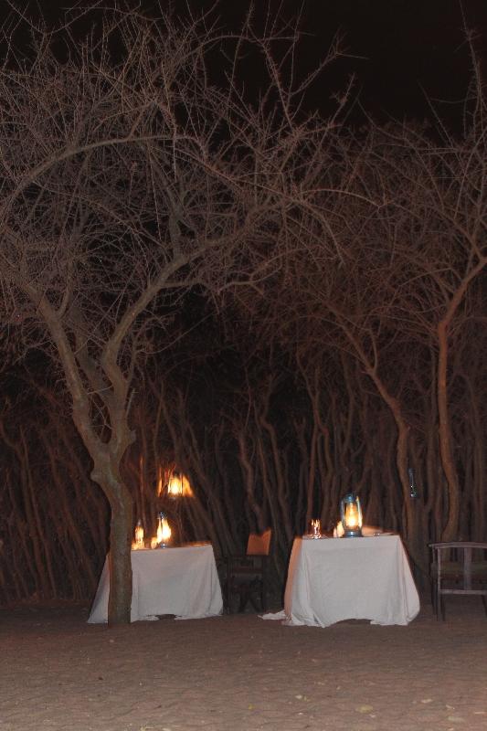 Beautiful dinner setting around the fireplace, Tanzania