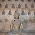 Lare Buddha statue in front of smaller ones